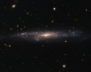 Hubble Sees Galaxy Hiding in the Night Sky